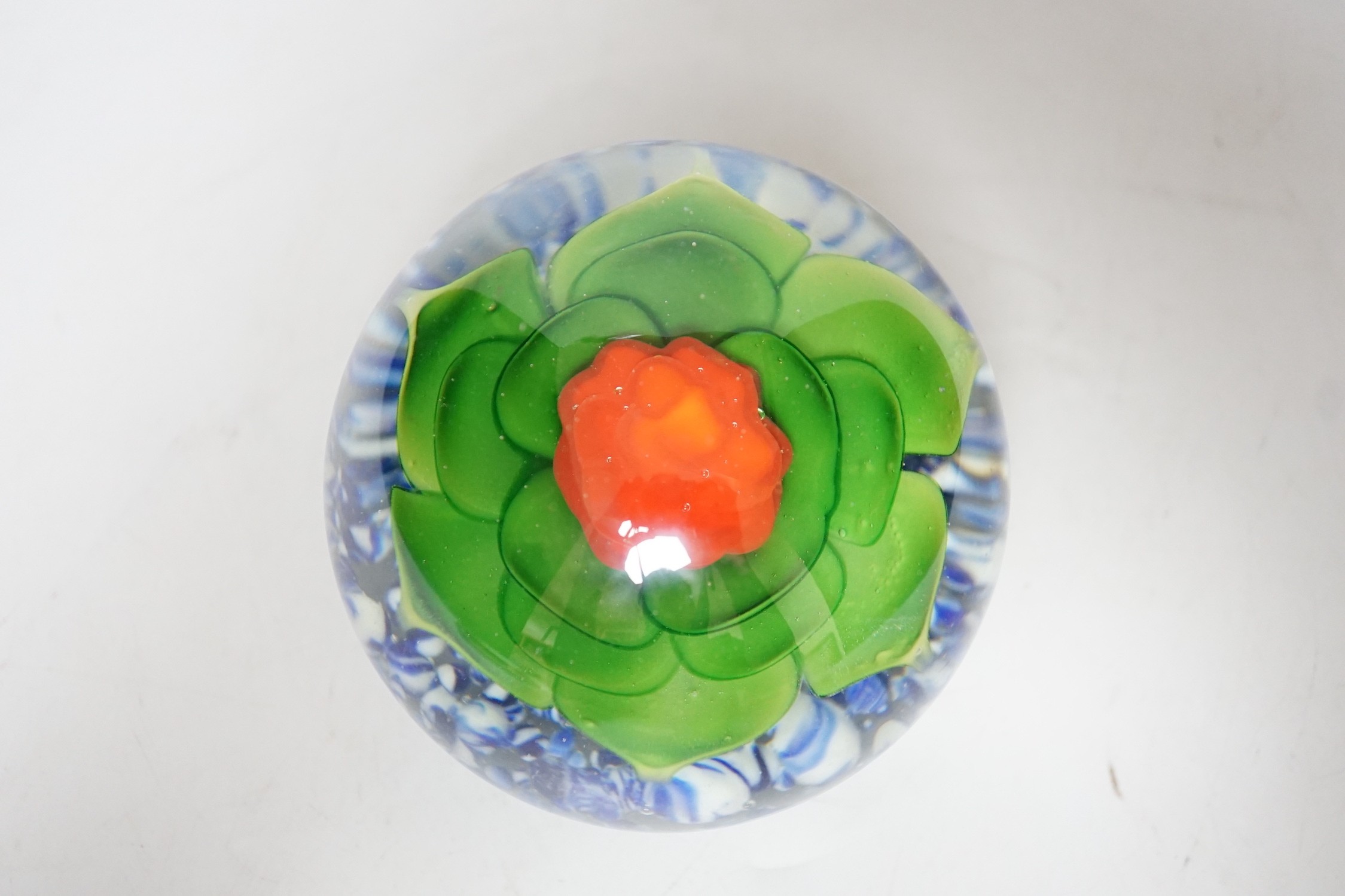 A large floral glass paperweight, 9cm tall